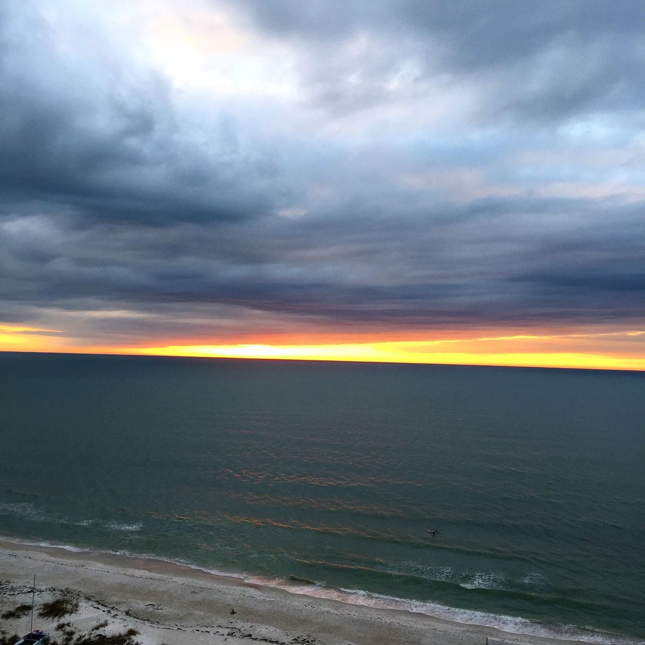 scenics, sky, tranquil scene, sunset, beauty in nature, tranquility, sea, cloud - sky, water, cloudy, horizon over water, nature, beach, weather, dramatic sky, idyllic, orange color, overcast, atmospheric mood, shore