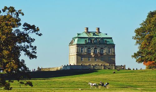Built structure on field against clear sky