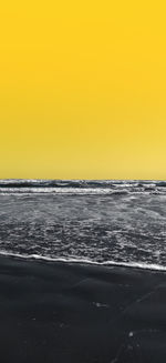 Scenic view of sea against clear sky during sunset