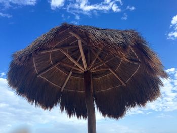 Low angle view of windmill against sky