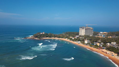 High angle view of beach against blue sky