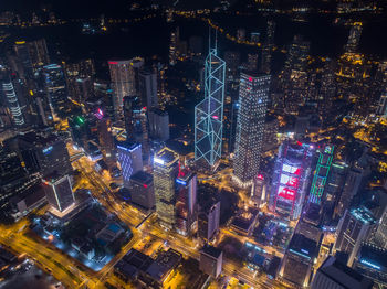 High angle view of city lit up at night