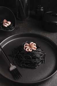 Black spaghetti with cuttlefish ink with octopus