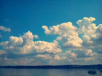 Scenic view of sea against cloudy sky