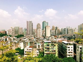 High angle view of modern buildings in city against sky