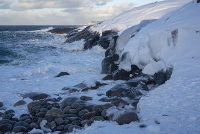 Scenic view of sea against sky during winter