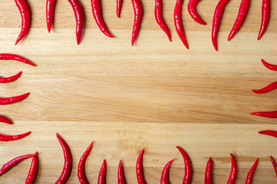 Directly above shot of red chili pepper on table