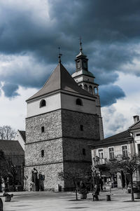 Low angle view of church against cloudy sky