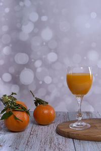 Close-up of orange juice on table