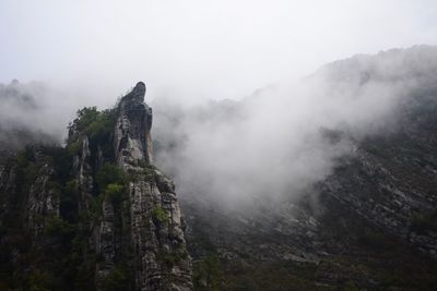 Scenic view of rocky mountains against sky