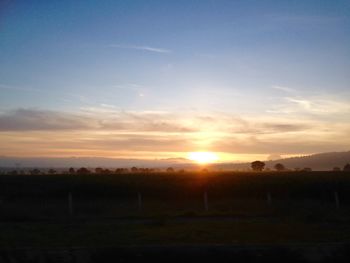 Scenic view of landscape at sunset