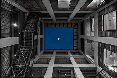 Low angle view of illuminated building against sky