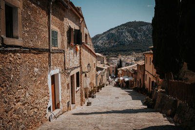 Narrow alley amidst buildings in town