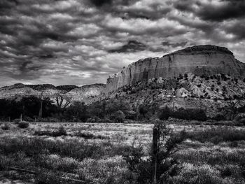 Scenic view of landscape against cloudy sky