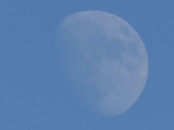 Close-up of moon against blue sky