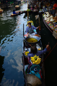 High angle view of people in boat at market