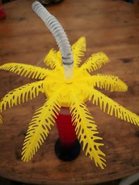 High angle view of yellow toy on table