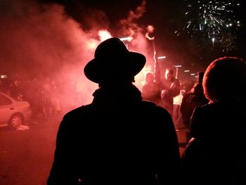 Silhouette people at night