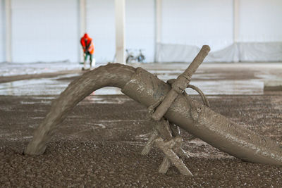 Concrete floor from pipe during concrete flooding of industrial building during construction process