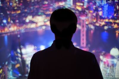 Close-up of woman standing at night