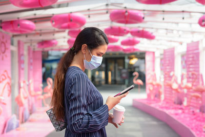 Young woman using mobile phone