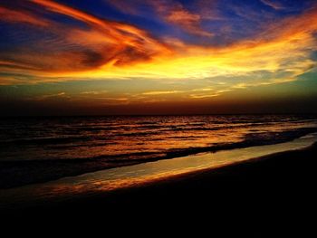 Scenic view of beach against sky during sunset