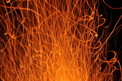 Close-up of sparks at night