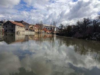 Panoramic view of river and buildings against sky