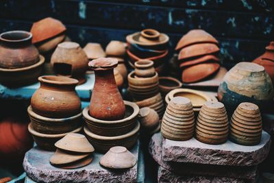 Close-up of clay containers at market stall