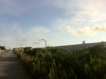 View of road against cloudy sky