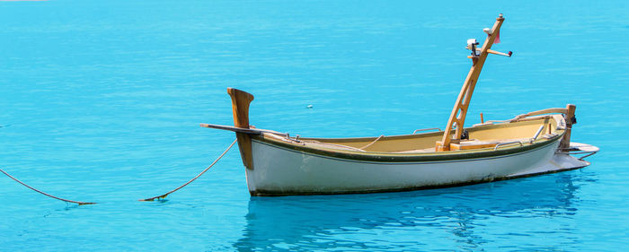 Boat moored in sea