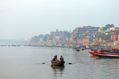 View of people on boat in city