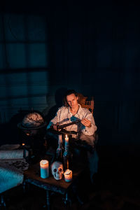 Young man drinking glasses on table