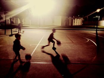 People playing basketball court