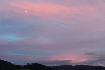 Low angle view of dramatic sky during sunset