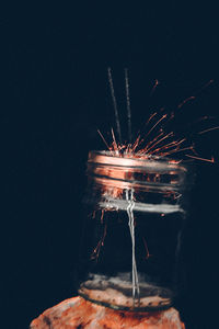 Close-up of firework display against sky at night