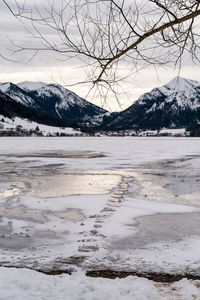 Scenic view of snowcapped mountains against sky during winter
