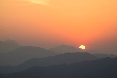 Scenic view of mountains at sunset