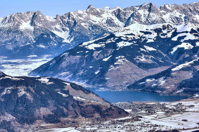 Wide valley of zell am see among snow capped austria alps