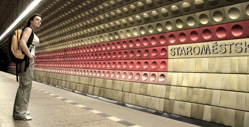 Woman standing at subway station