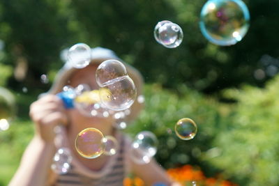 Close-up of bubbles against blurred background