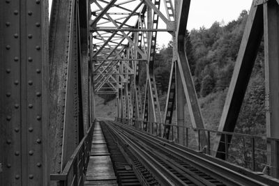 Railroad tracks by bridge