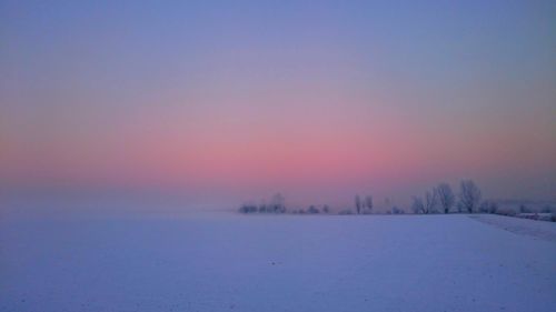 Scenic view of frozen landscape against sky