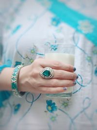 Close-up of woman hand holding glass of drink