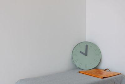Close-up of clock on wall
