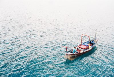 High angle view of boat sailing in sea against sky