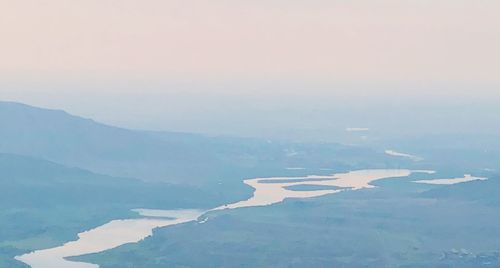 Scenic view of mountains against sky during sunset