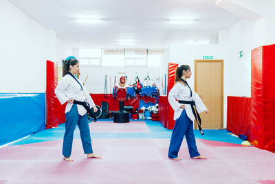 Young women practicing martial arts