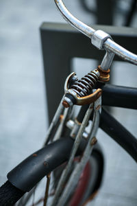 Close-up of bicycle parked on metal