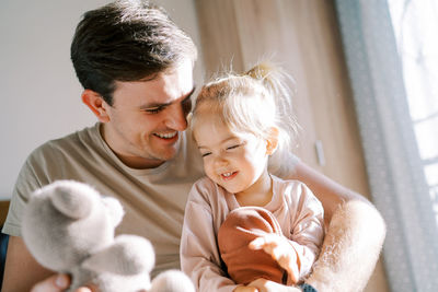 Close-up of mother and daughter at home